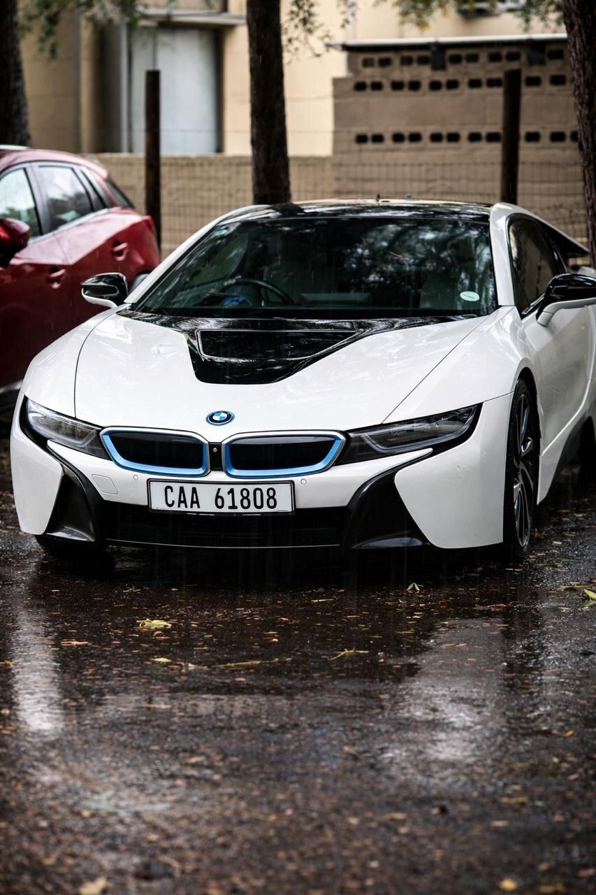 BMW i8 parked in the rain